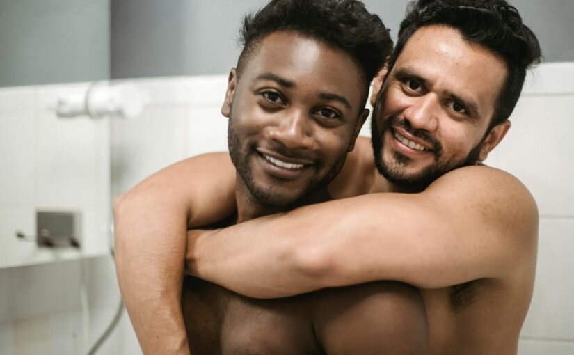 Topless Men Sitting on White Bathtub